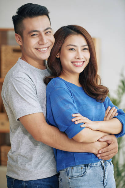 istock Beautiful young couple embracing and smiling 992033184