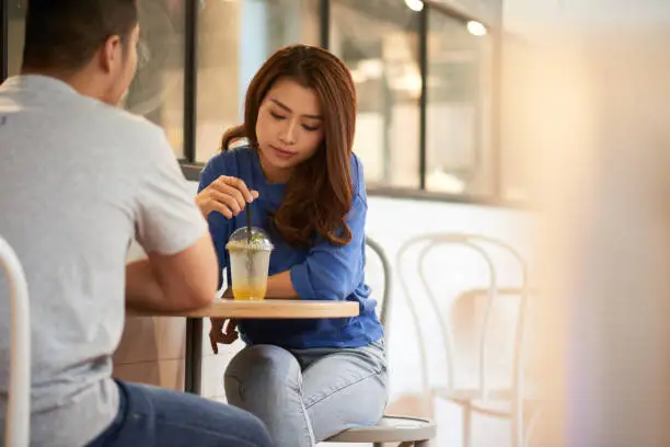 Photo of Woman on date with man having drink