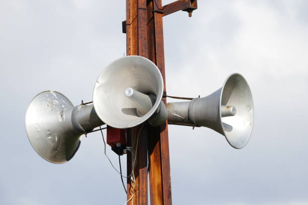 istock making announcements, audio speakers on the pole, 992034480