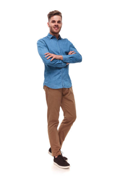istock handsome casual man standing with arms crossed 992034770