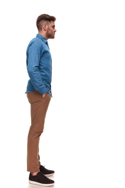 istock relaxed young casual man waiting in line 992039038