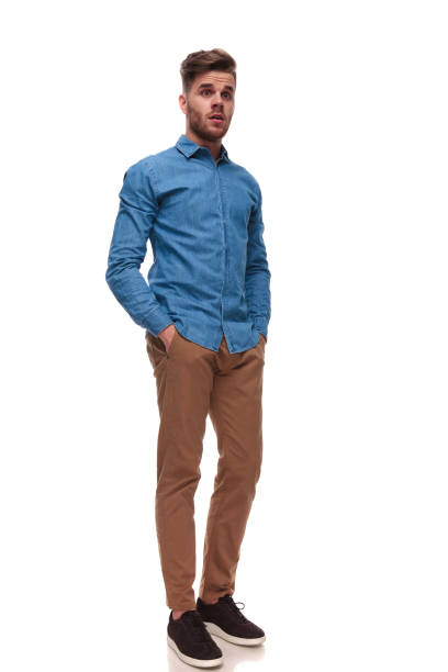 istock shocked casual man standing looks to side 992039050