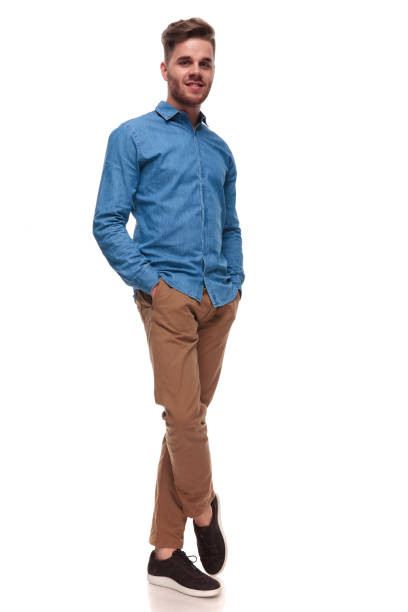 istock young casual man standing with legs crossed 992041682