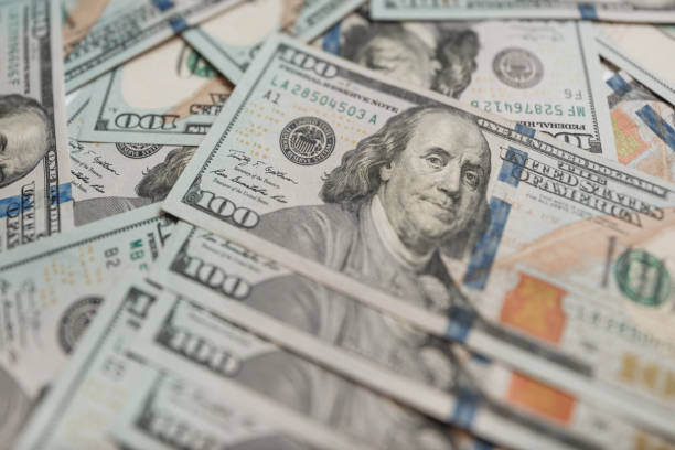 istock One Hundred Dollar Banknotes. Dollars Closeup Concept. 992042248