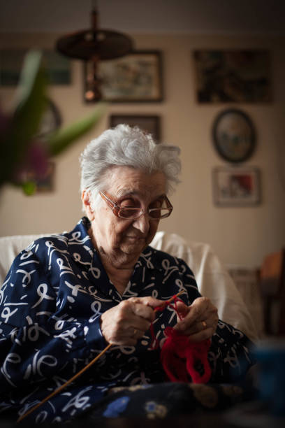 knitting up a storm. - knitting arthritis human hand women imagens e fotografias de stock