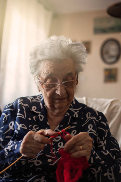Portrait of grandmother knitting.