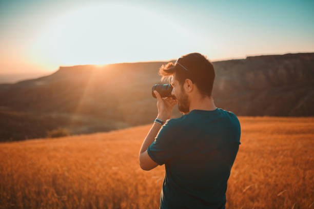 istock photographer documenting sunset photography 992052096