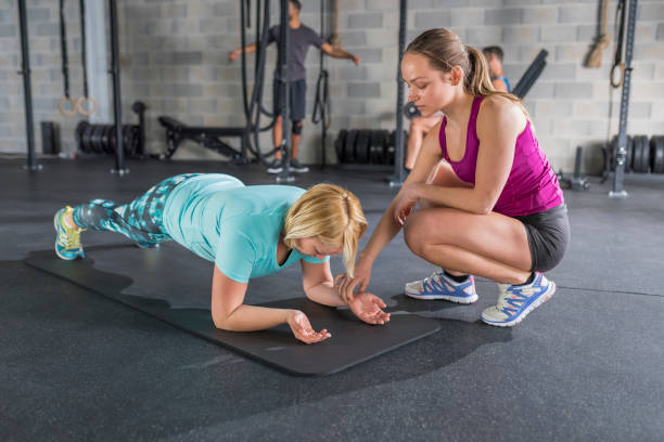 istock Instructor checking pulse trace of woman 992052260