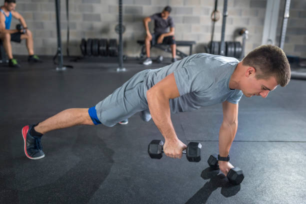 istock Mid adult man doing push-ups in gym 992052314
