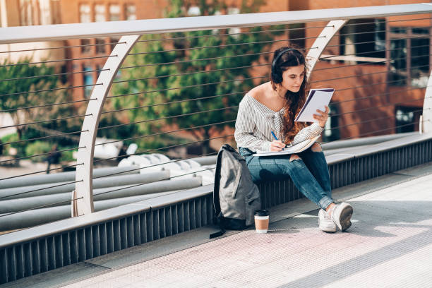 istock University student learning outdoors in London city 992056024