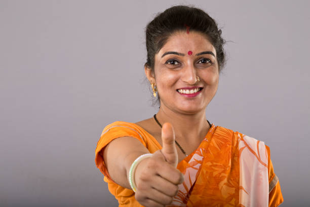 istock Young traditional woman showing thumbs up 992057582