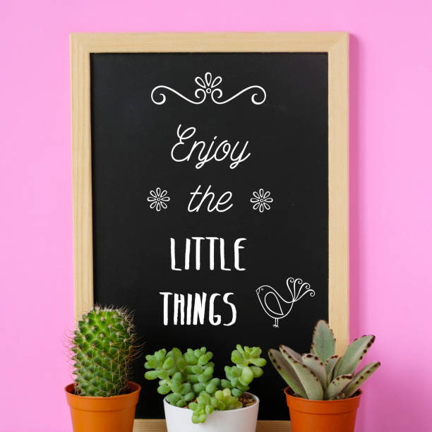 istock Enjoy the little things, positive quotation on vintage chalkboard 992060338