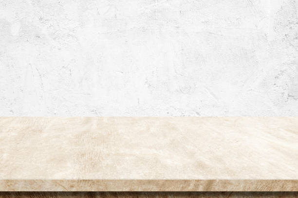istock Empty brown cement table over white wall background, banner, table top, shelf, counter design for product display montage 992061190