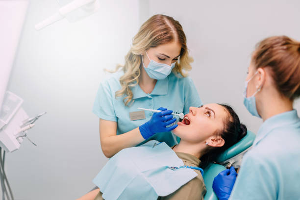 istock young woman is examined by dentist 992065444