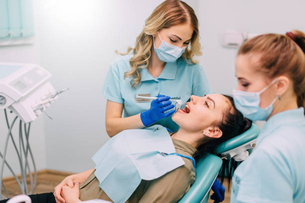 istock young woman is examined by dentist 992065536