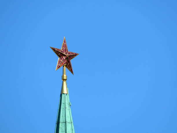 istock Kremlin Red star isolated on clear blue sky 992069652