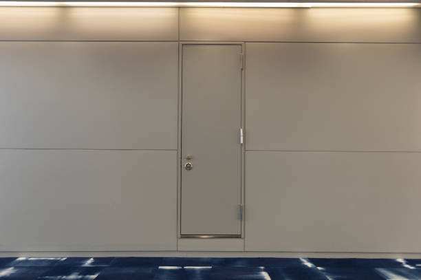 istock sidewalk by street wall & door 992073902