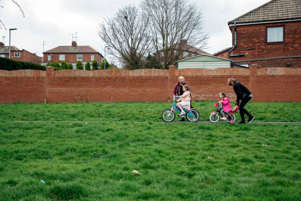 istock Out With Their Daughters Around Their Housing Estate 992074738