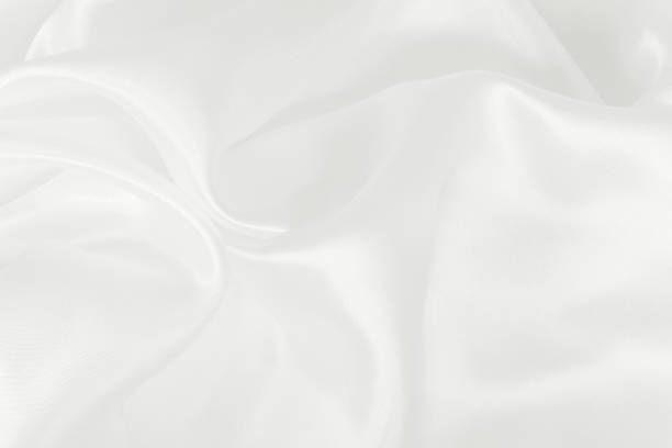 istock White fabric texture for background and design, beautiful pattern of silk or linen. 992075610
