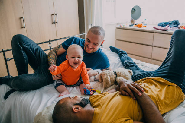 istock Gay Couple Playing With Their Son. 992075826