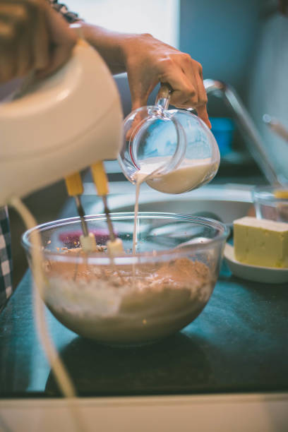istock happy woman cooking on kitchen 992078468