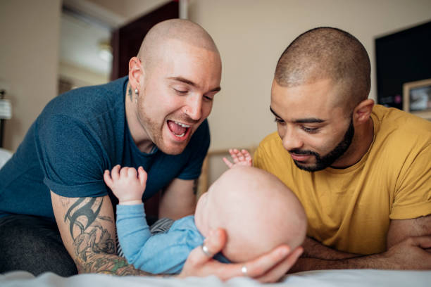 Father's And Son Playing Father's spend quality time with their baby boy. crew cut stock pictures, royalty-free photos & images