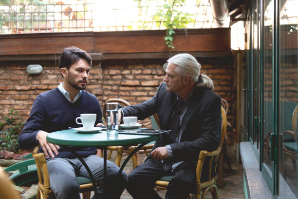 istock Two colleagues have a meeting in the cafe 992078894