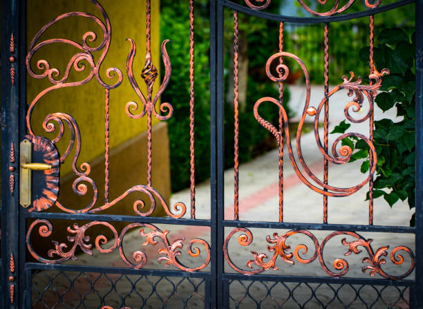 istock wrought-iron gates, ornamental forging, forged elements close-up 992079032