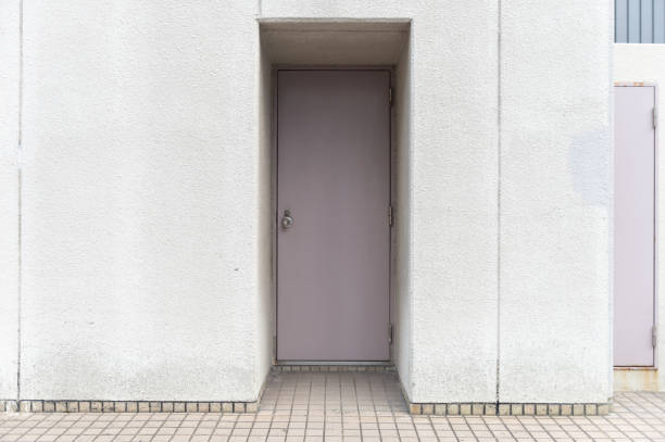istock sidewalk by street wall & door 992081194