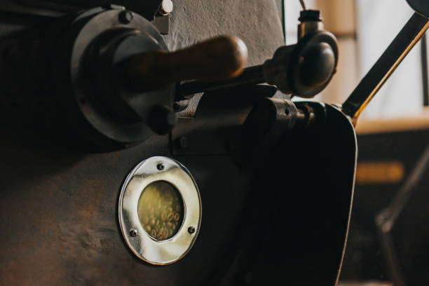 istock Coffee beans roasted in professional industrial machine 992083576