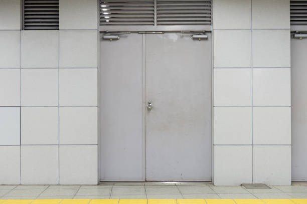 istock sidewalk by street wall & door 992084338