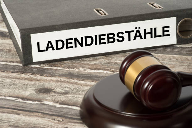 istock A judge's hammer and a folder with the imprint shoplifting 992084384
