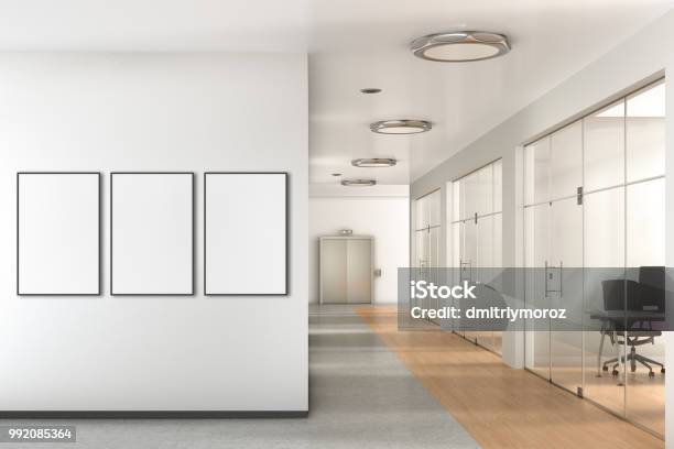 Blank Poster On The Wall In Modern Office Stock Photo - Download Image Now - Office, Poster, Wall - Building Feature