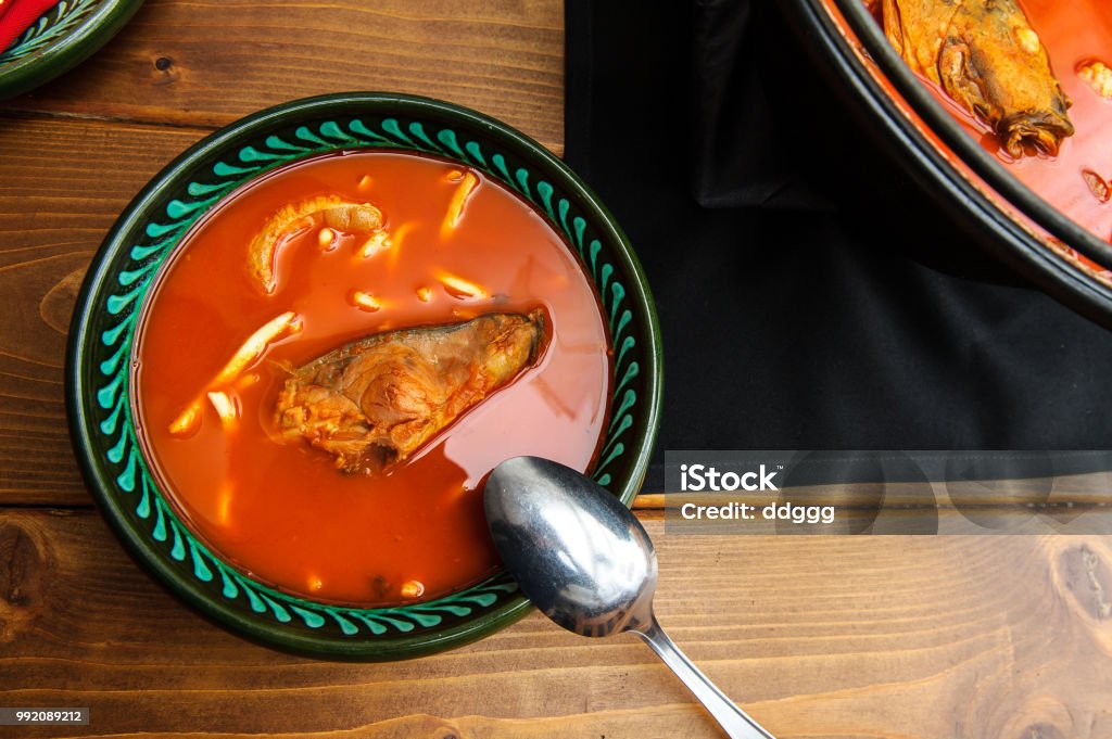 Fresh fish soup in bowl(Baja,Hungary) A cauldron with fish soup, which is cooked on a fireFresh fish soup in bowl Fish Stock Photo