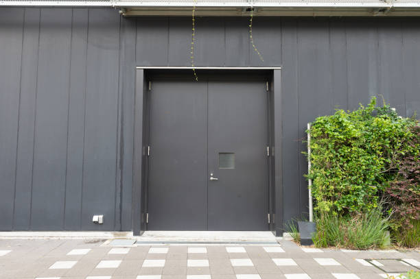 istock sidewalk by street wall & door 992095622