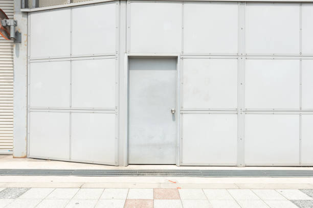 istock sidewalk by street wall & door 992096448