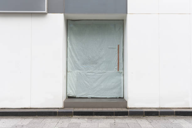 istock sidewalk by street wall & door 992097532