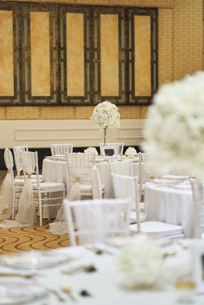 istock White roses, flower, floral decoration on the wedding reception dinner table 992099816