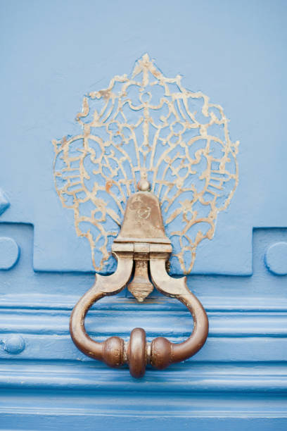 istock Blue door with old door knocker 992099994