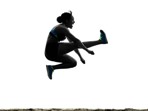 one african athlete athletics long jump woman isolated on white background silhouette
