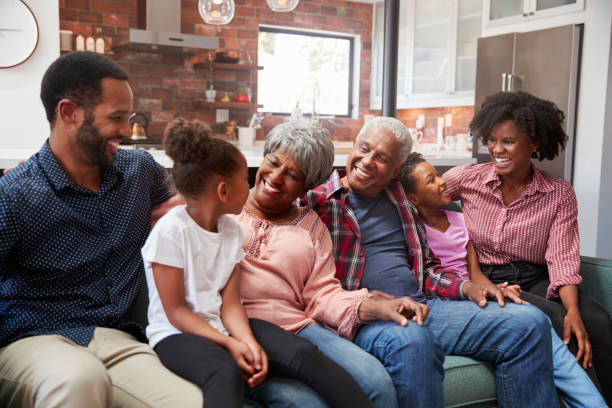 istock Multi Generation Family Relaxing On Sofa At Home Together 992107678