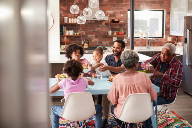 istock Multi Generation Family Enjoying Meal Around Table At Home 992108566