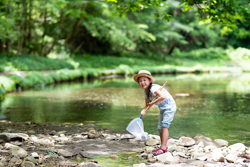 Girl playing in the river