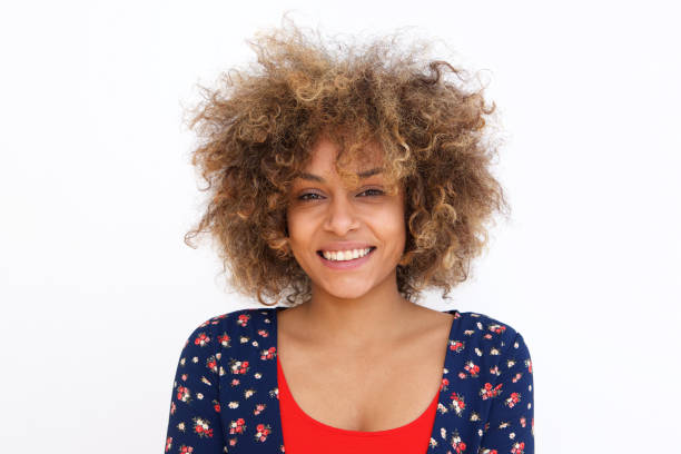 istock young black woman against white background smiling 992112236