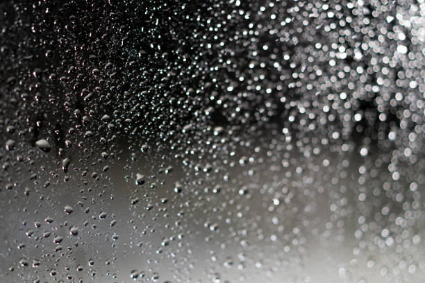 istock water drop on glass when raining for bakcground. 992118882