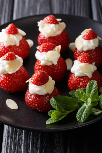 istock Christmas Strawberry Dessert stuffed with whipped cream. 992123526