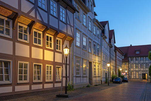 Typical half-timbered houses in twilight at dusk in old town of Goettingen, Lower Saxony, Germany