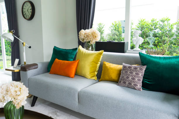 istock living room with grey sofa and colorful pillows 992129266