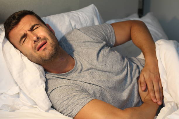 istock Sick male with abdominal pain 992132806