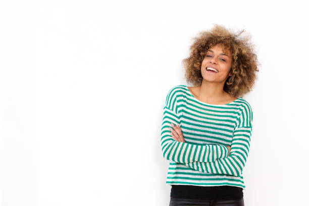 istock confident young black woman smiling against white background 992137978